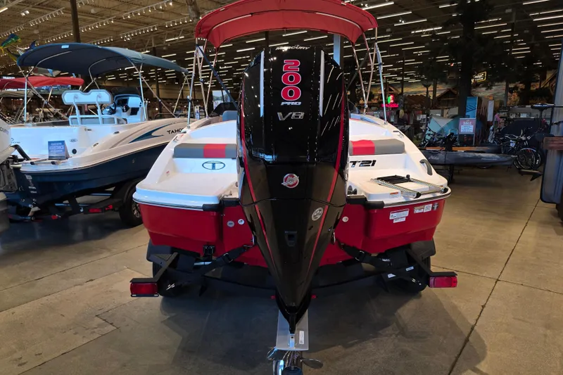 Slide: The Image of 2026 Tahoe T21 boat with 200 Pro V8 engine displayed in showroom. - 1