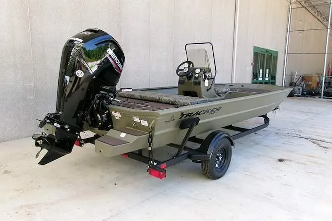 Slide: The Image of 2026 Tracker Grizzly 1860 CC boat with outboard motor on trailer. - 2