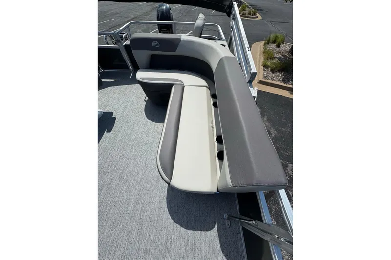 Slide: The Image of 2026 Sun Tracker Bass Buggy 18 DLX pontoon boat with spacious seating and cup holders. - 97