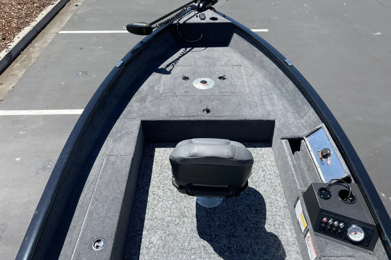 Slide: The Image of 2026 Tracker Super Guide V-16 T boat interior with seating and control panel. - 12