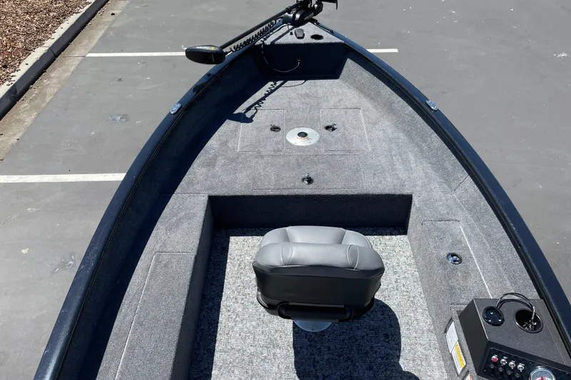 Slide: The Image of 2026 Tracker Super Guide V-16 T fishing boat interior with seating and control panel. - 13