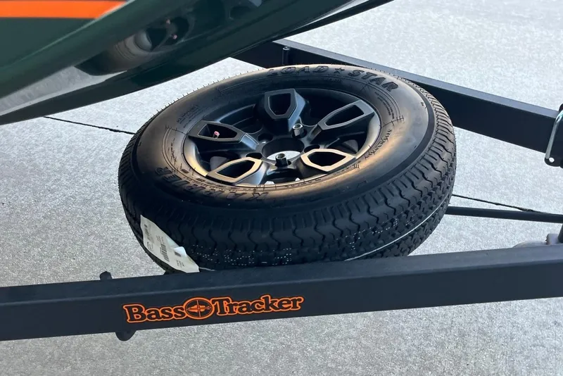 Slide: The Image of 2026 Tracker Bass Tracker Classic Limited trailer with spare tire on display. - 5