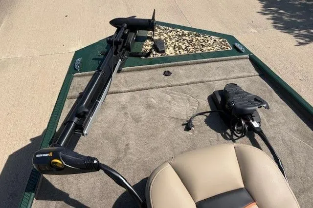 Slide: The Image of 2026 Tracker Bass Tracker Classic Limited boat interior with trolling motor and seating. - 2