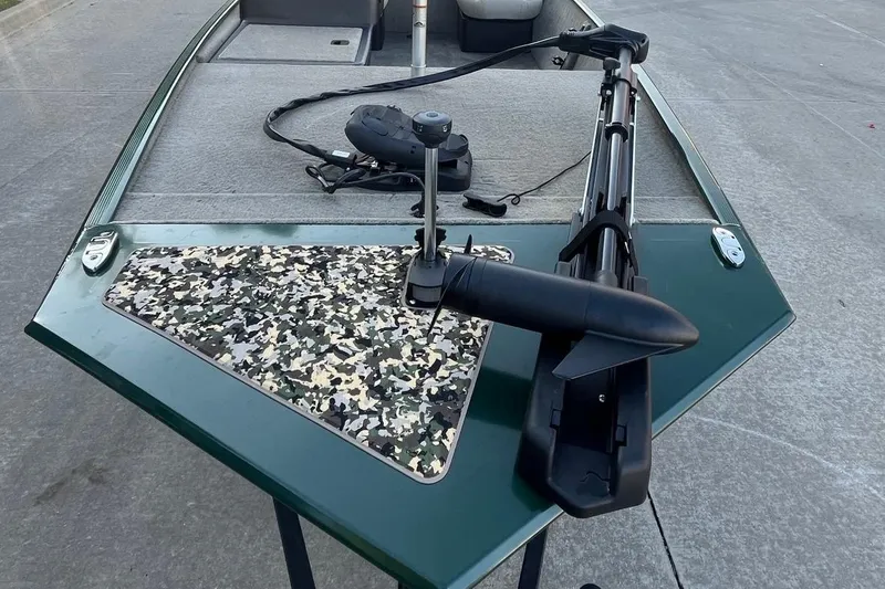 Slide: The Image of 2026 Tracker Bass Tracker Classic Limited boat with camouflage deck and trolling motor. - 6