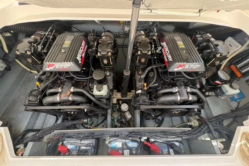 Slide: The Image of Twin Mercury engines in a 2001 Sea Ray 290 Sun Sport boat engine compartment. - 18