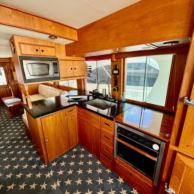 Slide: The Image of Interior of 1999 Grand Banks 52 Europa yacht featuring modern kitchen. - 16