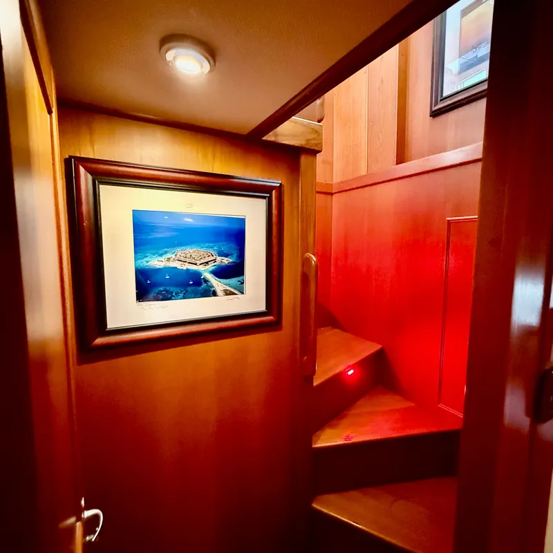 Slide: The Image of Interior of Grand Banks 52 Europa yacht, staircase with wall art. - 19