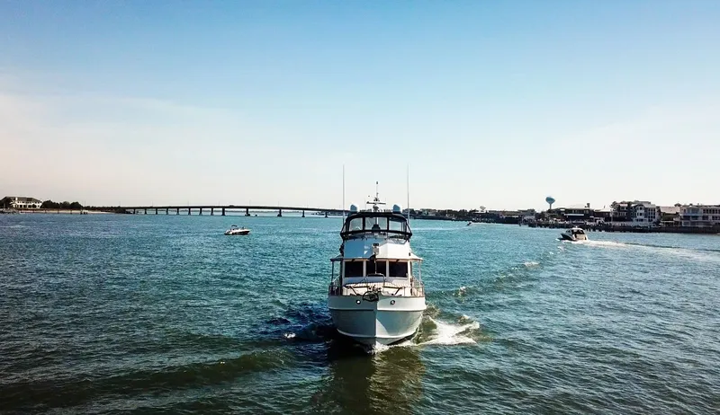 Slide: The Image of 1999 Grand Banks 52 Europa yacht cruising on water. - 38