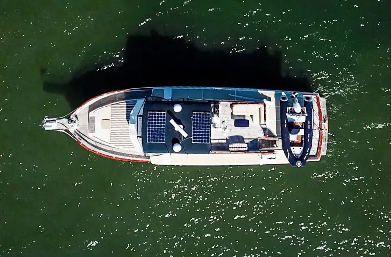 Slide: The Image of Aerial view of a Grand Banks 52 Europa yacht on water. - 5