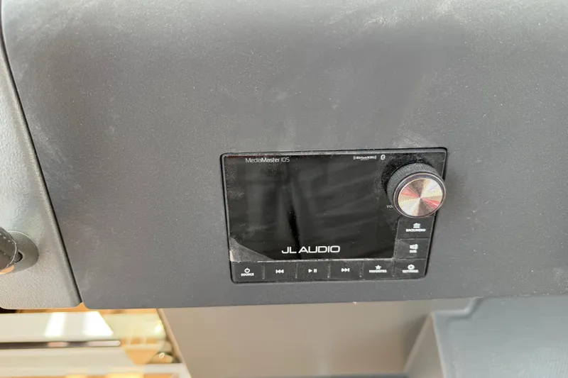 Slide: The Image of JL Audio MediaMaster display on 2025 Nimbus Tender 11 boat dashboard. - 21