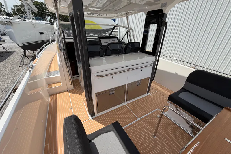 Slide: The Image of Interior view of 2025 Nimbus Tender 11 boat, featuring sleek seating and modern design. - 22