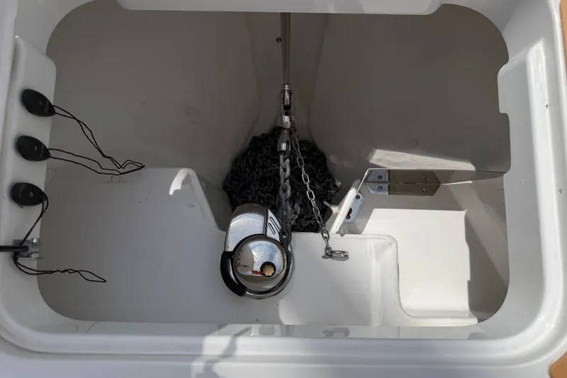 Slide: The Image of Anchor compartment of 2025 Nimbus Tender 11 boat, featuring chain and winch system. - 30