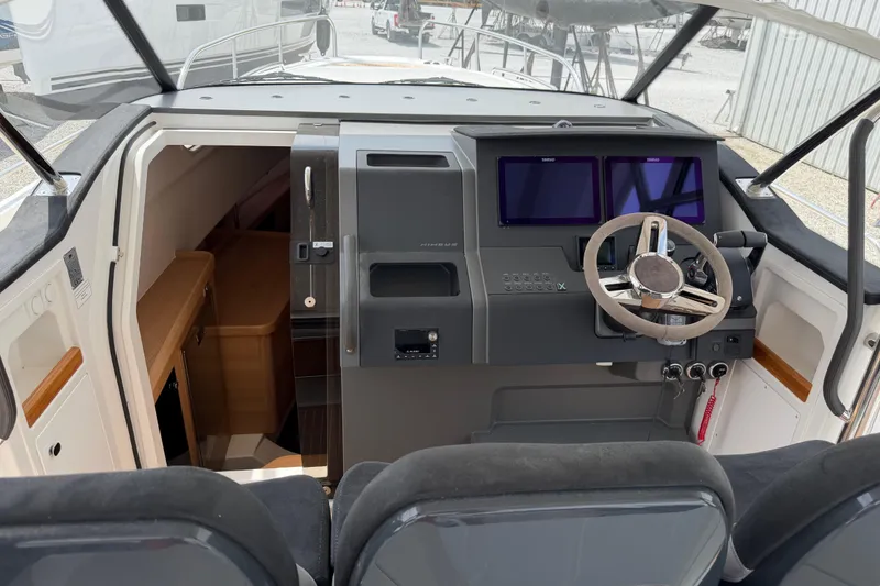 Slide: The Image of Interior cockpit of 2025 Nimbus Tender 11 with modern navigation controls and steering wheel. - 5