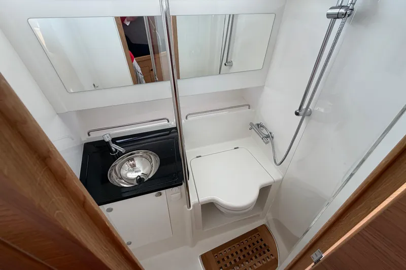 Slide: The Image of Modern bathroom in 2025 Nimbus Tender 11 yacht with sink, toilet, and shower. - 9