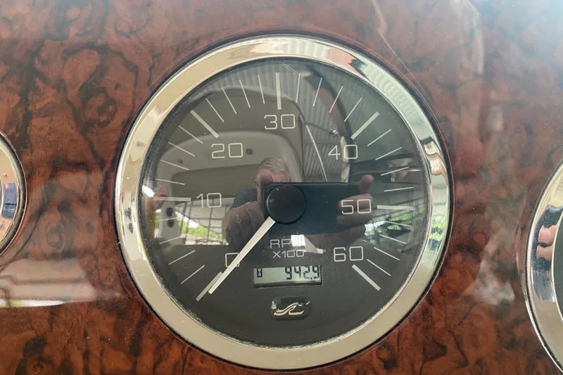 Slide: The Image of Close-up of a 2003 Sea Ray Sundancer 320 RPM gauge, showing 942.9 hours. - 12