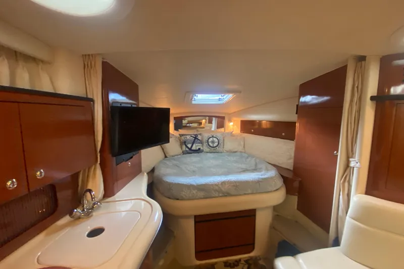 Slide: The Image of Luxurious interior of 2003 Sea Ray Sundancer 320 yacht with cozy bed and modern amenities. - 17