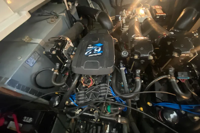 Slide: The Image of Engine compartment of a 2003 Sea Ray Sundancer 320 boat, showcasing mechanical components. - 22