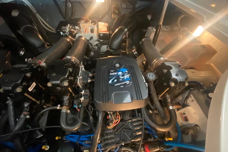 Slide: The Image of Engine compartment of a 2003 Sea Ray Sundancer 320 boat, featuring MerCruiser components. - 23