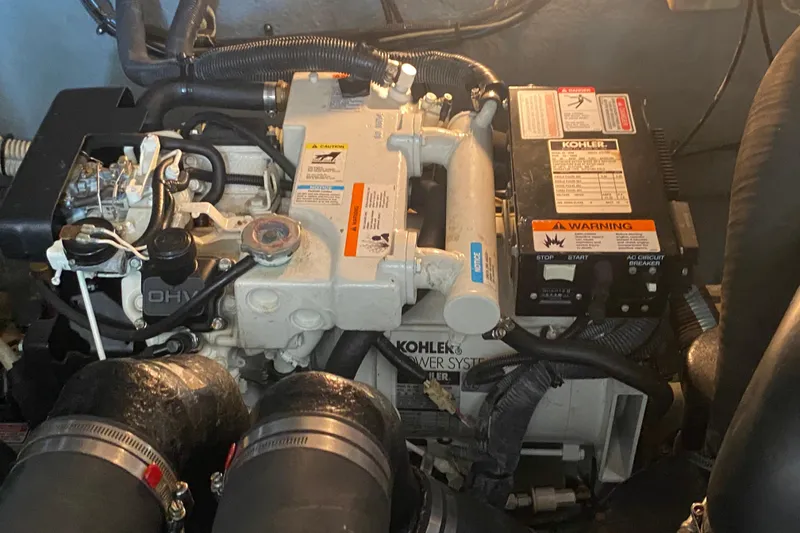 Slide: The Image of Engine compartment of a 2003 Sea Ray Sundancer 320 with Kohler power system. - 24