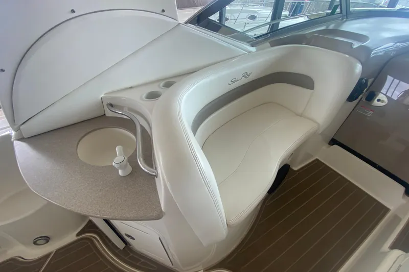 Slide: The Image of 2003 Sea Ray Sundancer 320 interior with seating and sink area, featuring elegant design. - 29