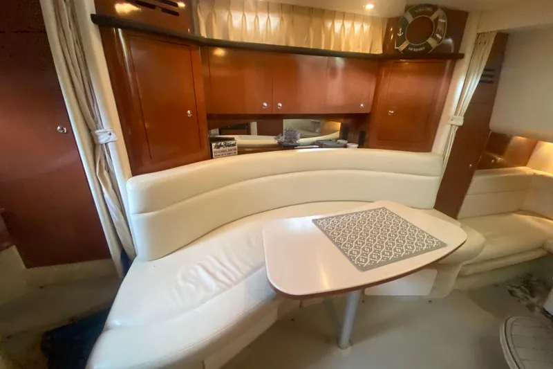 Slide: The Image of Interior of 2003 Sea Ray Sundancer 320 with elegant seating and wooden cabinetry. - 35