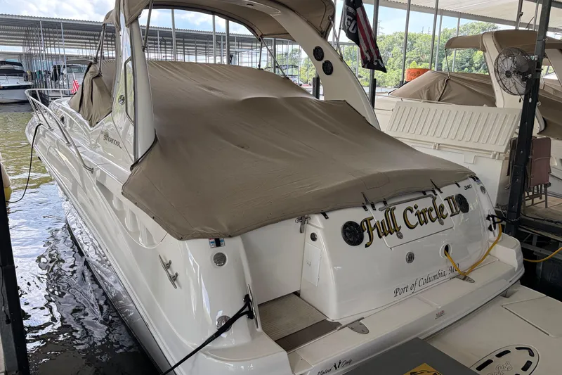 Slide: The Image of 2003 Sea Ray Sundancer 320 docked, covered, with "Full Circle II" name visible. - 36