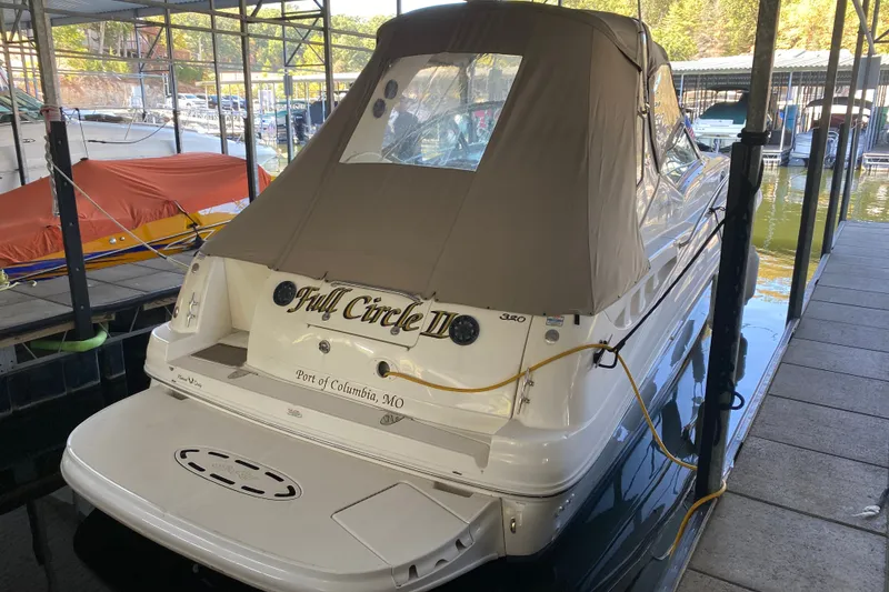 Slide: The Image of 2003 Sea Ray Sundancer 320 docked, covered, with "Full Circle II" name visible. - 40