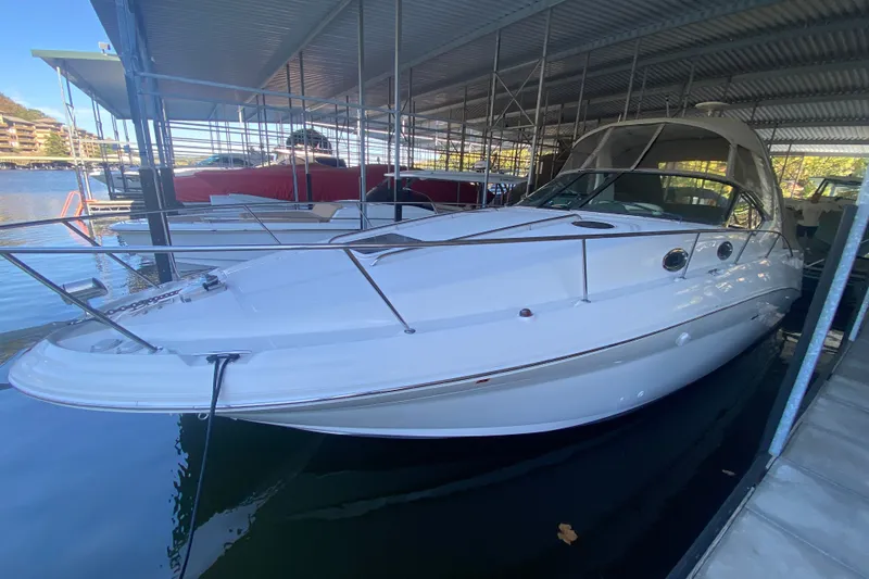 Slide: The Image of 2003 Sea Ray Sundancer 320 docked in a covered marina. - 39
