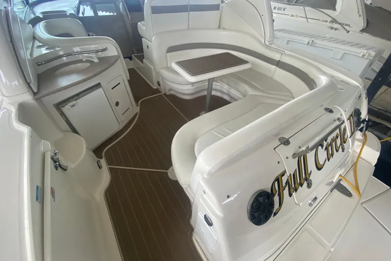 Slide: The Image of Interior of a 2003 Sea Ray Sundancer 320 boat with seating and table. - 8