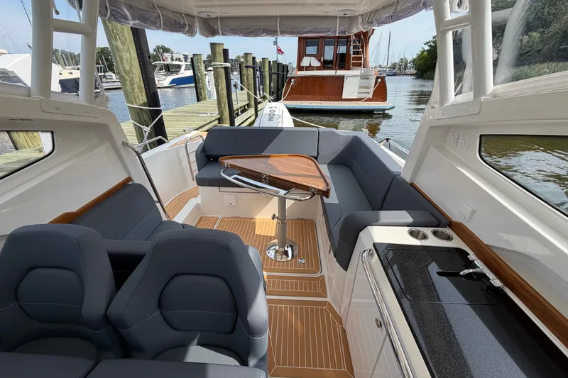 Slide: The Image of Luxurious interior of 2025 Nimbus Weekender 9 boat with seating and table. - 7