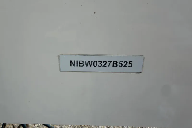 Slide: The Image of VIN plate of a 2025 Nimbus Weekender 9, displaying "NIBW0327B525". - 15
