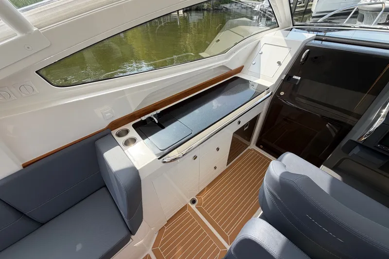 Slide: The Image of Interior of 2025 Nimbus Weekender 9 boat with sleek seating and modern kitchenette. - 8