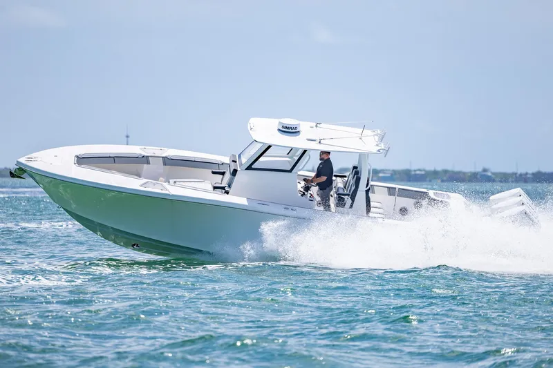 Slide: The Image of 2025 Streamline R 35 boat cruising on open water, showcasing sleek design and performance. - 12