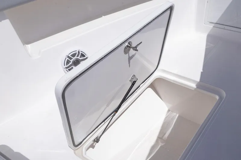 Slide: The Image of Open storage compartment on 2025 Streamline R 35 boat, featuring a sleek white design. - 14