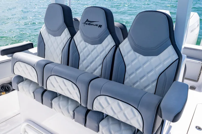 Slide: The Image of Luxurious seating on 2025 Streamline R 35 boat with quilted design and ocean backdrop. - 22