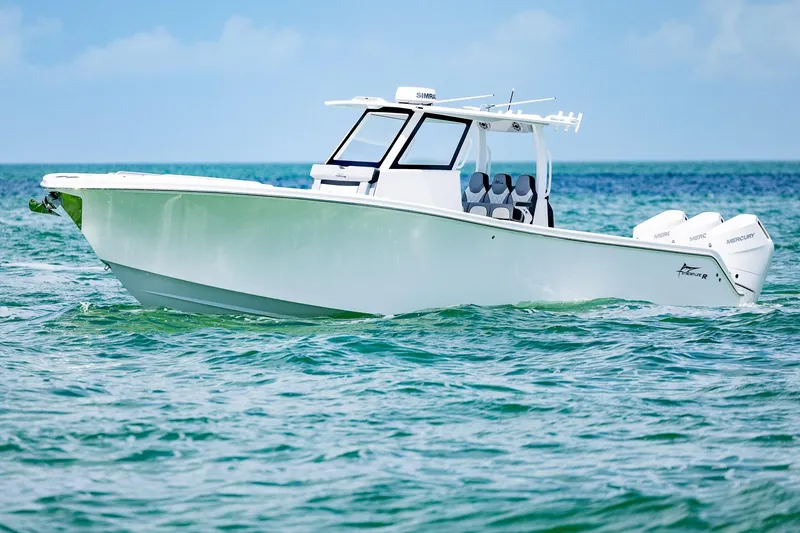 Slide: The Image of 2025 Streamline R 35 boat cruising on clear blue ocean waters. - 3