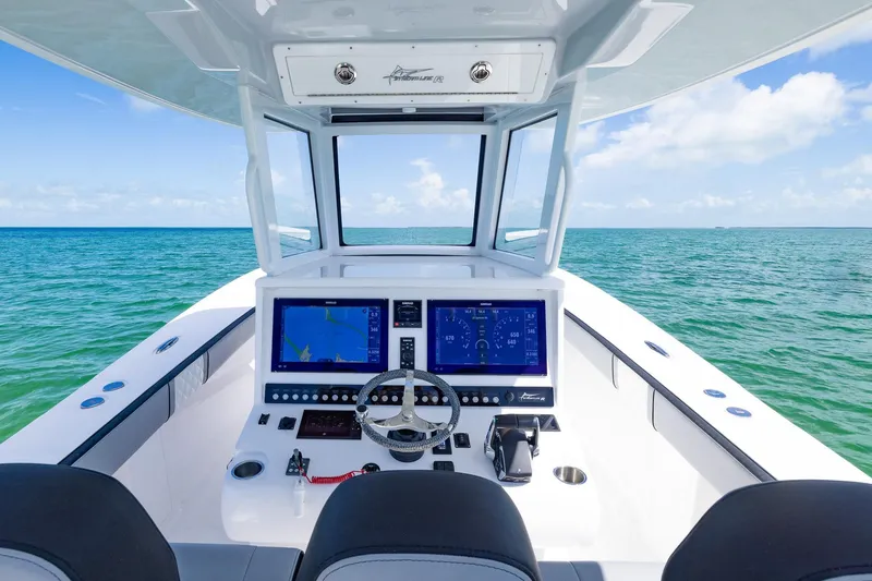 Slide: The Image of 2025 Streamline R 35 boat cockpit with advanced navigation system on open sea. - 33