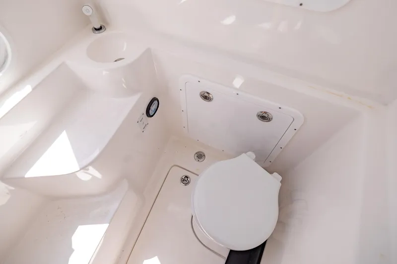Slide: The Image of Compact bathroom in 2025 Streamline R 35 model with white fixtures and storage. - 39
