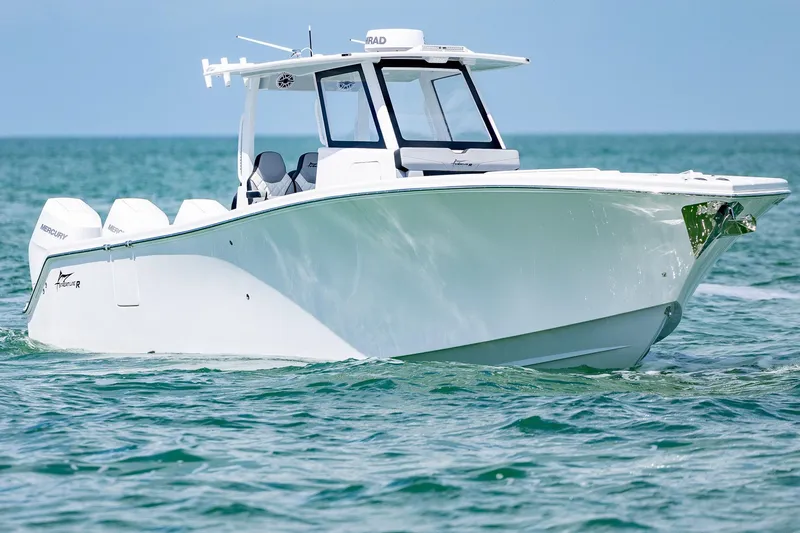 Slide: The Image of 2025 Streamline R 35 boat cruising on clear blue water. - 4