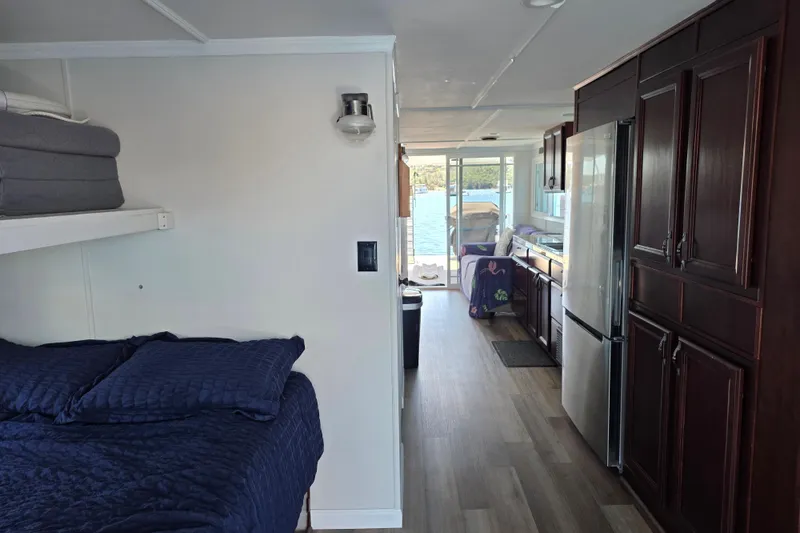 Slide: The Image of Interior of a 2007 custom houseboat with cozy bedroom and modern kitchen. - 17