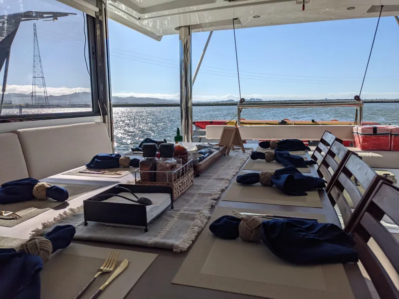 Slide: The Image of Dining setup on a 2021 Bali 4.8 catamaran with ocean view. - 21