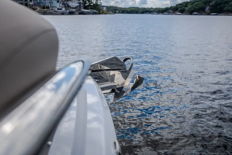 Slide: The Image of 2022 Steeler Bronson 50 yacht with anchor, docked on a serene lake. - 53