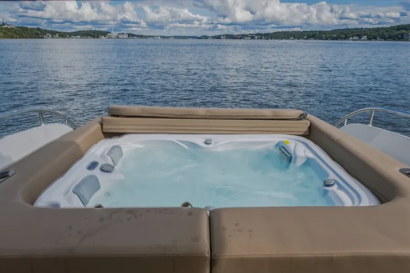 Slide: The Image of Luxurious hot tub on 2022 Steeler Bronson 50 yacht, overlooking serene lake view. - 31