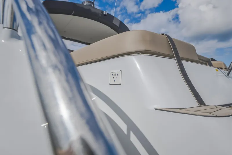 Slide: The Image of 2022 Steeler Bronson 50 yacht with sleek design and beige seating under blue sky. - 19