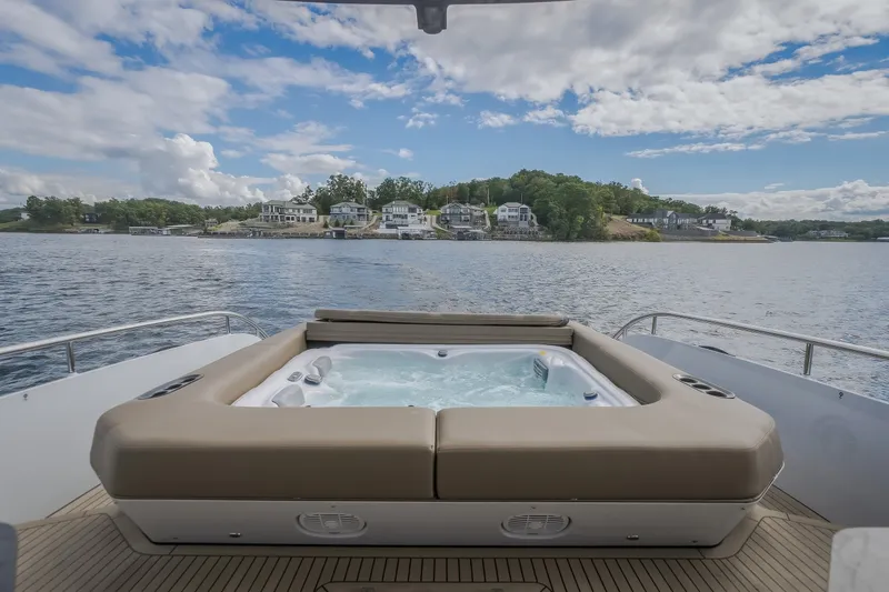 Slide: The Image of Luxurious 2022 Steeler Bronson 50 yacht with hot tub, scenic waterfront view. - 14
