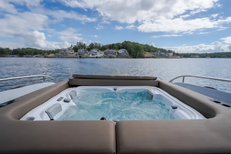 Slide: The Image of Luxury hot tub on 2022 Steeler Bronson 50 yacht, scenic waterfront view. - 15