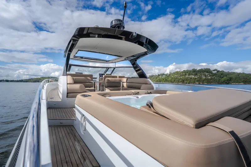 Slide: The Image of Luxury Steeler Bronson 50 yacht, 2022 model, featuring spacious deck and seating, cruising on water. - 16