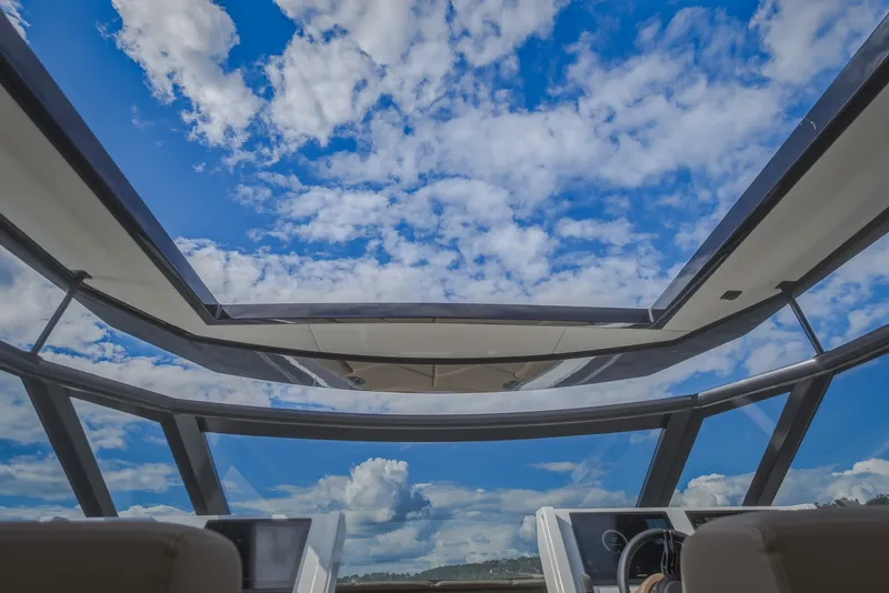 Slide: The Image of Interior view of 2022 Steeler Bronson 50 yacht with panoramic glass roof and blue sky. - 42