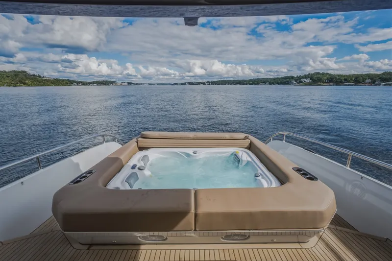 Slide: The Image of Luxurious hot tub on 2022 Steeler Bronson 50 yacht, overlooking serene waters and scenic landscape. - 34