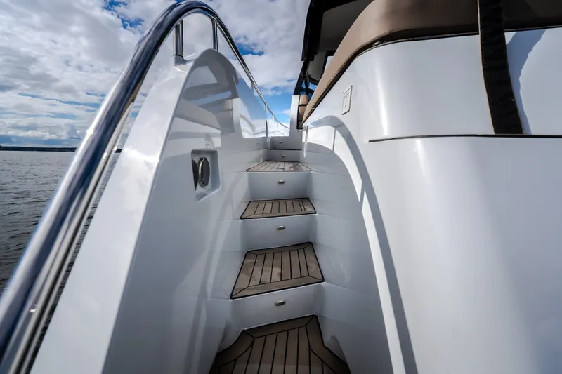 Slide: The Image of Staircase on 2022 Steeler Bronson 50 yacht, featuring sleek design and wooden steps. - 17
